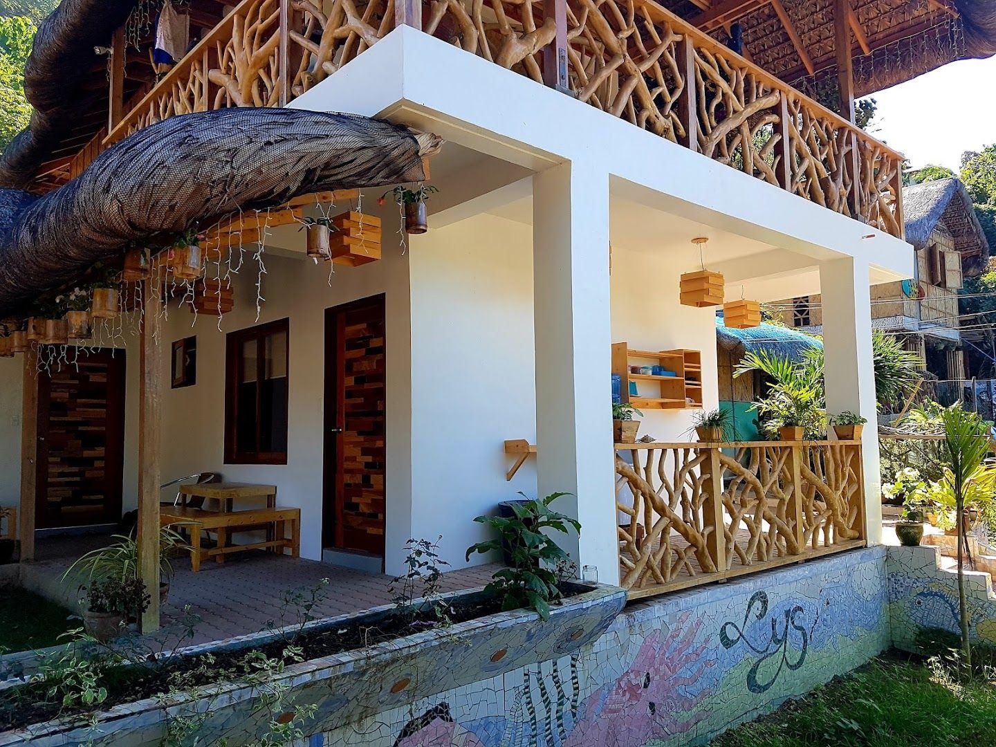 Lokal Home exterior showing kubo architecture and mosaic art